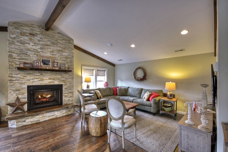 Main Street Cottage- Living room area with a fireplace