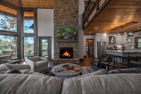 The Ridgeline Retreat- Main level living area with a fireplace and TV