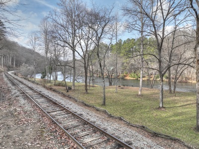 River Lodge- Railroad tracks dividing the river and the cabin