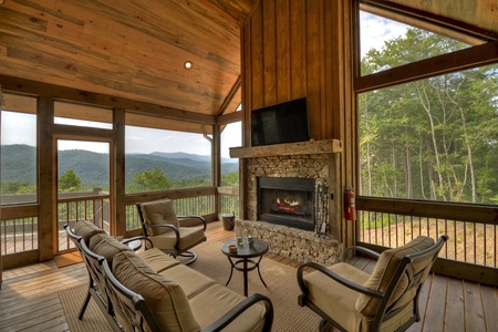 3 Peaks - Outdoor Fireplace and seating with a tv set and mountain view