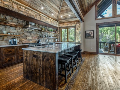 Misty Trail Lakehouse- Full kitchen view with island and stools
