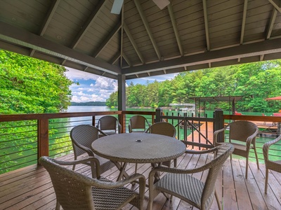 Gleesome Inn- View from the gazebo of the lake with outdoor seating