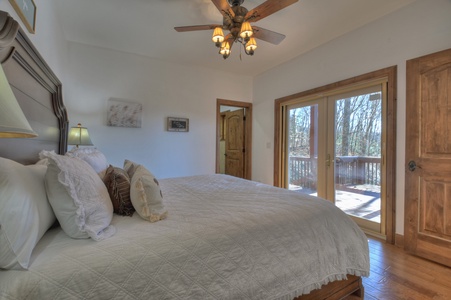 Family Farmhouse- Entry level guest king bedroom with deck access