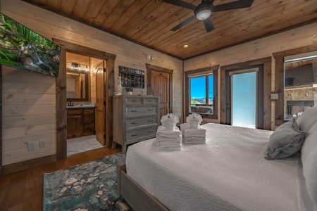 The Ridgeline Retreat- Main level second king bedroom with bathroom suite and deck access