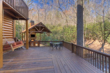 Rushing Waters - Back deck looking over to covered Seating area