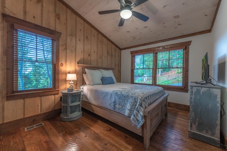 Southern Star- King bedroom area with a dresser and TV