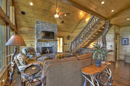 The Vue Over Blue Ridge- Living room area with a fireplace and TV