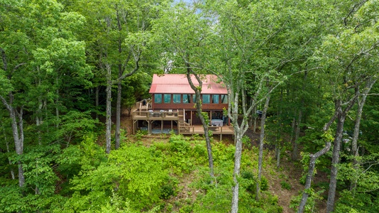 Sunset in the Mountains - Aerial View of Cabin