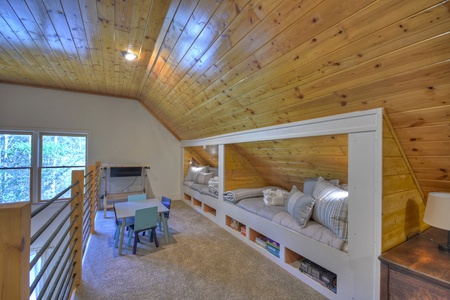 Sipping Rise- Lofts twin bunk area with kids table and games