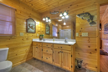 Grand Mountain Lodge- Entry level master bathroom vanity sink and mirror