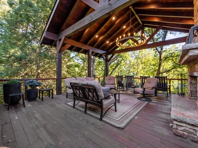 River Joy Lodge- Entry Level Deck Fireplace Seating Area