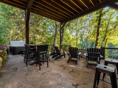 River Joy Lodge- Lower Level Covered Seating Hot Tub Area