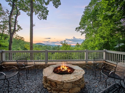 Aska Bliss- Stone firepit with outdoor seating with a mountain view
