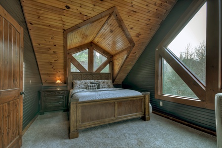 River Lodge- upper level guest bedroom with matching window designs
