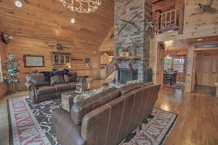 Grand Mountain Lodge- Living room area with a fireplace and couches