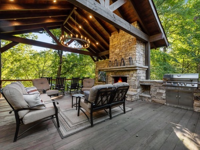 River Joy Lodge- Entry Level Deck Fireplace Seating Area