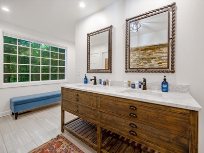 Gleesome Inn- Double vanity sink and mirrors in the master bathroom