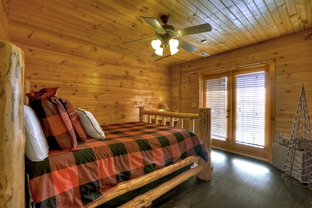 Grand Mountain Lodge- Lower level queen bedroom with deck entry doors