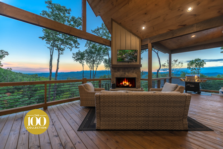 Southern Star- Covered patio area with outdoor seating and fireplace