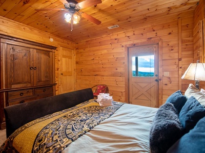 Aska Bliss- Lower level bedroom with deck access door