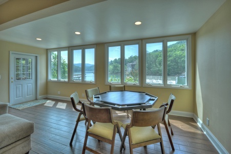 Jump Right In- Lower level poker table with chairs and view of the lake