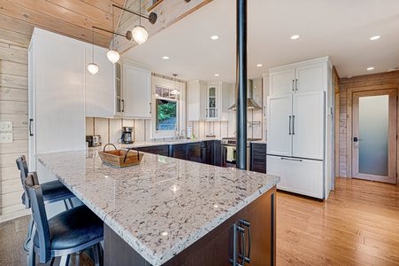 Kricket's Overlook- View of the kitchen with an island and cabinets