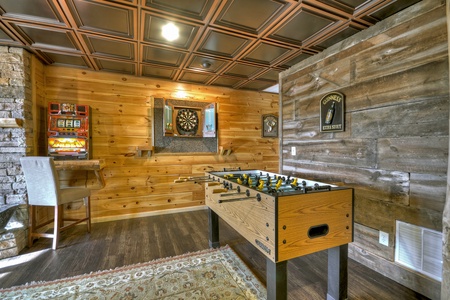 Grand Mountain Lodge- Game room with foosball table and a dart board