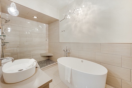 Kricket's Overlook- Lower level guest bathroom with a walk in shower and soaker tub