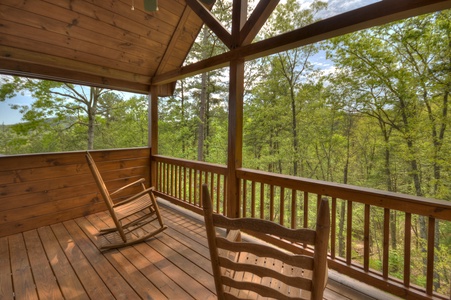 Aska Lodge-Upper level master bedroom private balcony seating and deck view