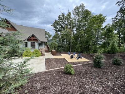 New Heights- View of the firepit area and cabin from the landscaping