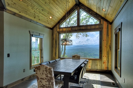 New Heights- Dining room area with table and chairs