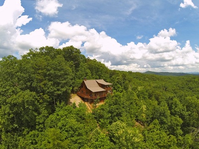 Above Raven Ridge- Aerial view of the cabin in the mountains
