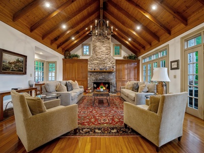 Gleesome Inn- Main living area with couch seating and a fireplace