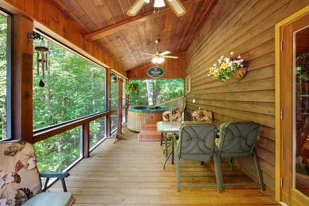 Awesome Retreat- Screened in deck seating area with a hot tub