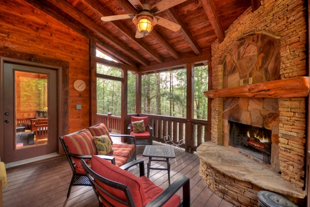 Reel Creek Lodge- Outdoor fireplace with cozy seating and cabin entryway
