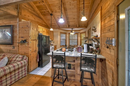 The Good Place- Entry level kitchen area with view of the island and stools