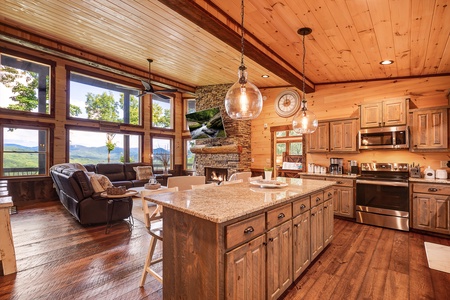 Feather & Fawn Lodge- Kitchen view with hanging light fixtures and an island