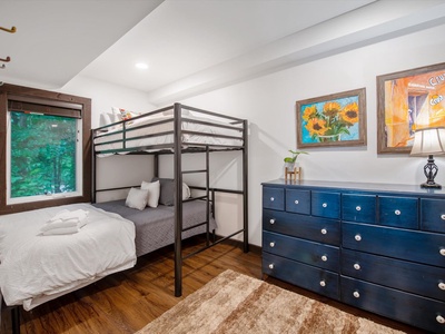 Gleesome Inn- Lower level bunk room with a dresser