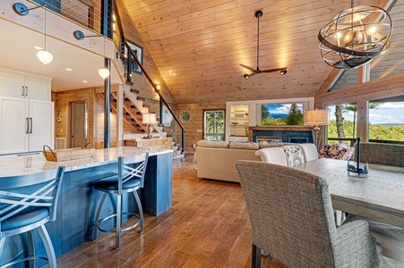 Kricket's Overlook- Entryway view of the cabin with dining area, island seating and living area