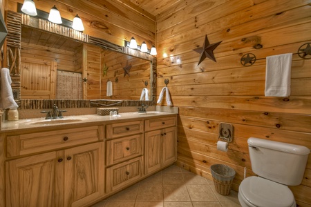 Above Ravens Ridge- Main level attached bathroom with double vanity sink