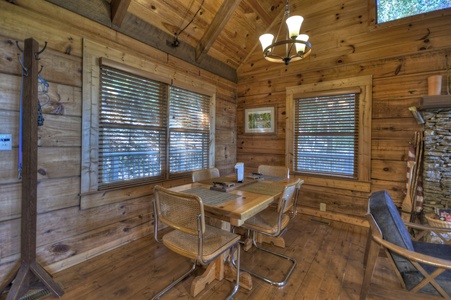 Ridgetop Pointaview- Dining table and chairs with the living area beside it