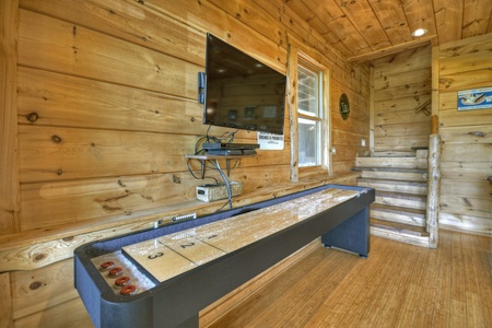 View From The Top- Lower level den shuffleboard with mounted TV