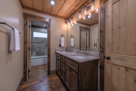 Highland Escape- Upstairs master bathroom with double vanity sink