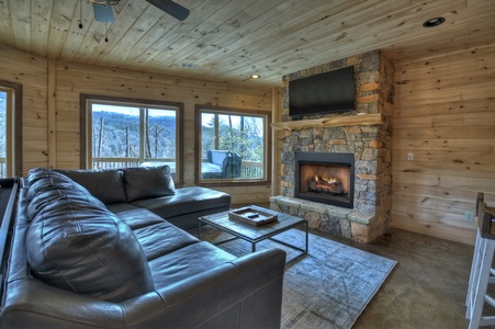Whisky Creek Retreat- Lower level seating area with fireplace and TV