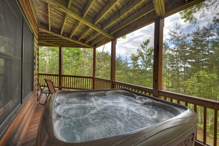 Aska Lodge- Hot tub on the lower level deck with a forest view