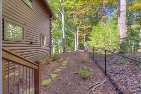 Trails End- Fenced in yard leading to the front porch