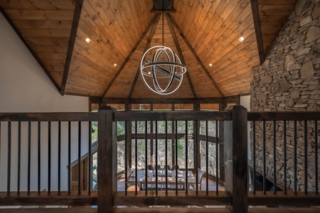 The Ridgeline Retreat- Loft view with a vaulted ceiling