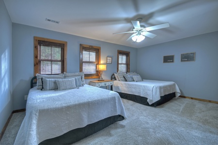 River Lodge- Upper level guest bedroom area with two queen beds