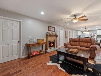The River House - Living Room with Fireplace