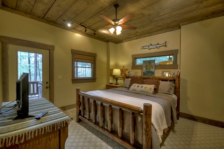 Reel Creek Lodge- Lower level king bedroom with deck access